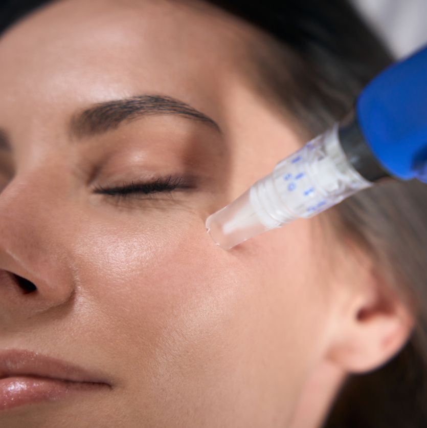 woman receiving facial treatment