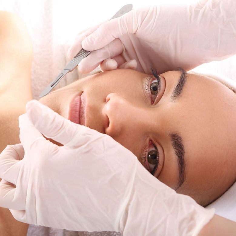 woman receiving dermaplaning treatment