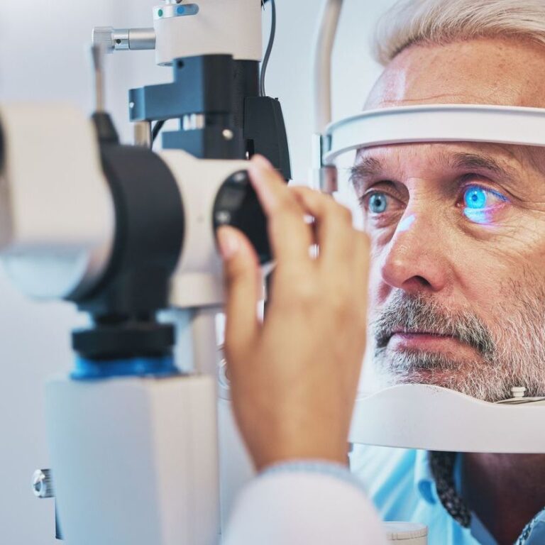 Ophthalmology, medical and eye exam with old man and consulting for vision, healthcare and glaucoma check. Laser, light and innovation with face of patient and machine for scanning and optometry